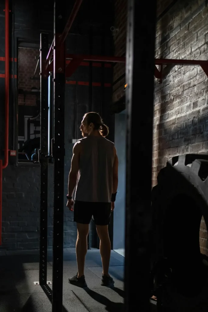 Man in Activewear Standing Inside the Gym