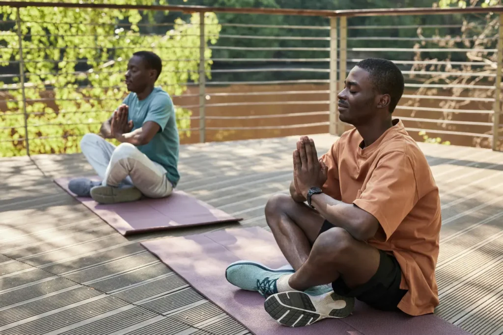 Men Meditating With Their Eyes Closed