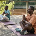 Men Meditating With Their Eyes Closed